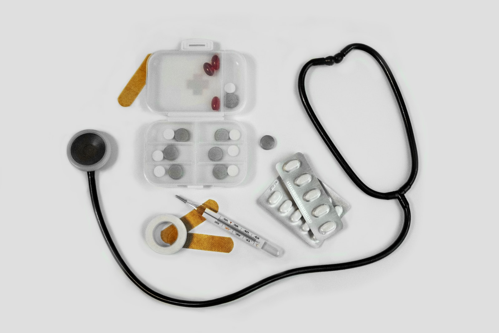 white and black earbuds on white textile dog first aid kit